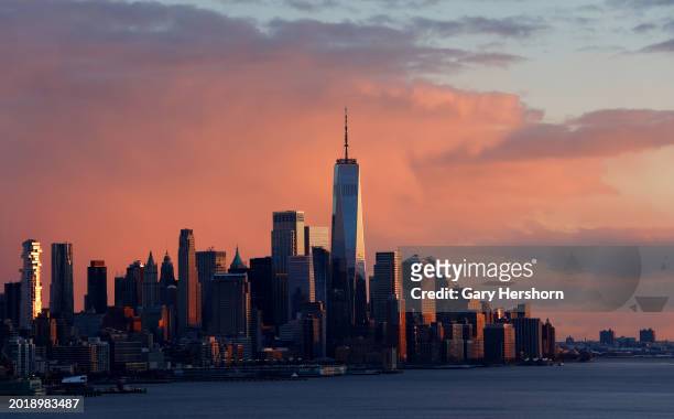 The sun sets on the skyline of lower Manhattan and One World Trade Center in New York City on February 17 as seen from Weehawken, New Jersey.