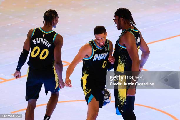Bennedict Mathurin, Tyrese Haliburton and Myles Turner of the Indiana Pacers react in the 2024 Kia Skills Challenge during the State Farm All-Star...