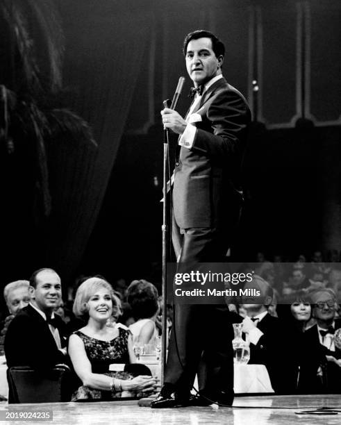American photographer Martin Mills , his wife, actress Edie Adams and actor Gary Crosby listen to actor and singer Danny Thomas in Los Angeles,...