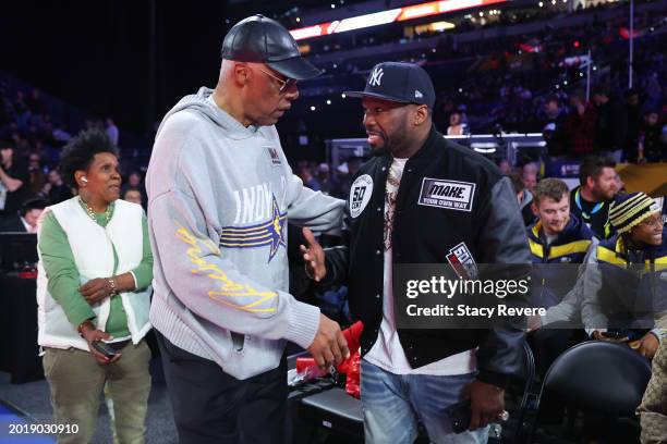 Julius Erving and 50 Cent speak on the court during the State Farm All-Star Saturday Night at Lucas Oil Stadium on February 17, 2024 in Indianapolis,...