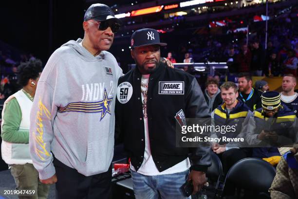Julius Erving and 50 Cent speak on the court during the State Farm All-Star Saturday Night at Lucas Oil Stadium on February 17, 2024 in Indianapolis,...