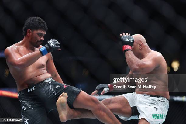 Marcos Rogerio de Lima exchanges strikes with Junior Tafa in their heavyweight fight during UFC 298 at Honda Center on February 17, 2024 in Anaheim,...