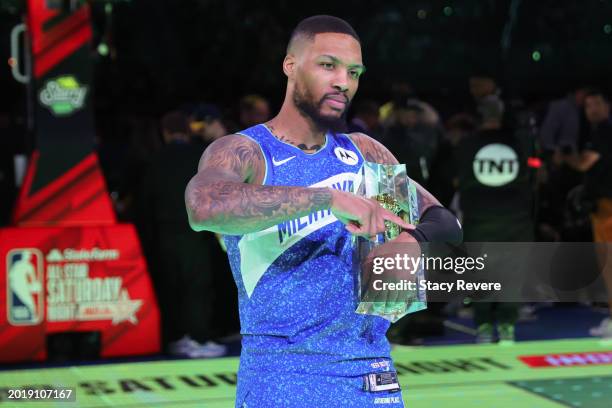 Damian Lillard of the Milwaukee Bucks celebrates after winning the 2024 Starry 3-Point Contest during the State Farm All-Star Saturday Night at Lucas...