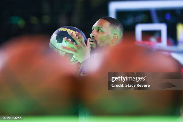 Damian Lillard of the Milwaukee Bucks participates in the 2024 Starry 3-Point Contestduring the State Farm All-Star Saturday Night at Lucas Oil...
