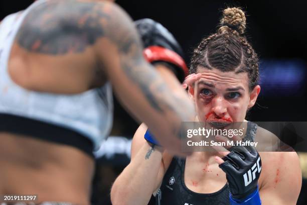 Amanda Lemos of Brazil exchanges strikes with Mackenzie Dern in their women's strawweight fight during UFC 298 at Honda Center on February 17, 2024...