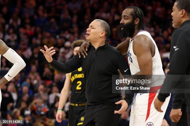 James Harden holds back LA Clippers head coach Tyronn Lue during their game against the Golden State Warriors at Chase Center on February 14, 2024 in...