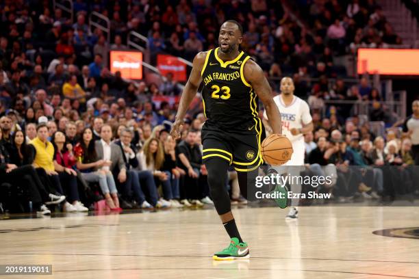 Draymond Green of the Golden State Warriors dribbles the ball against the LA Clippers at Chase Center on February 14, 2024 in San Francisco,...