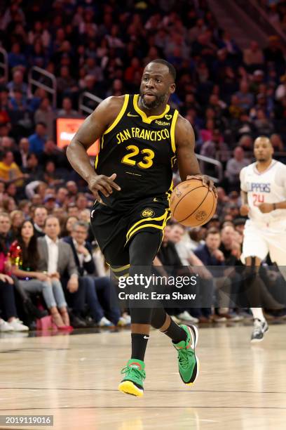 Draymond Green of the Golden State Warriors dribbles the ball against the LA Clippers at Chase Center on February 14, 2024 in San Francisco,...
