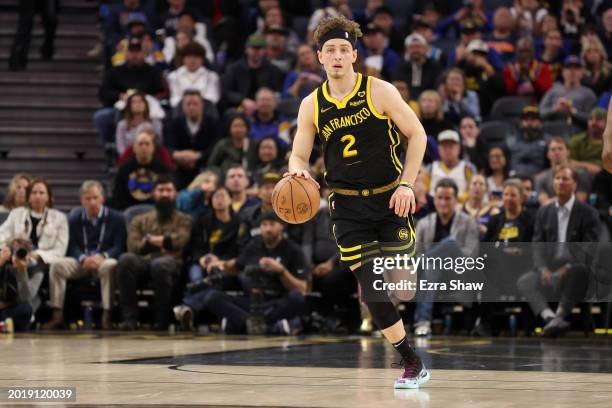 Brandin Podziemski of the Golden State Warriors dribbles the ball against the LA Clippers at Chase Center on February 14, 2024 in San Francisco,...