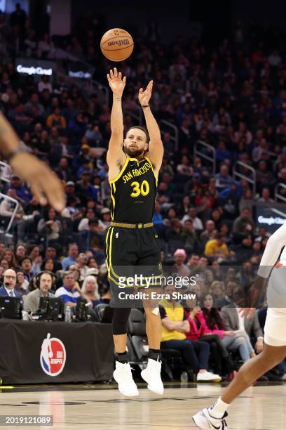 Stephen Curry of the Golden State Warriors shoots the ball against the LA Clippers at Chase Center on February 14, 2024 in San Francisco, California....