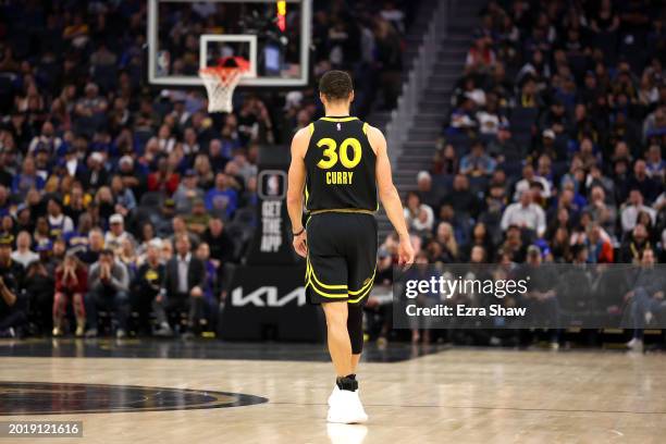 Stephen Curry of the Golden State Warriors stands on the court during their game against the LA Clippers at Chase Center on February 14, 2024 in San...