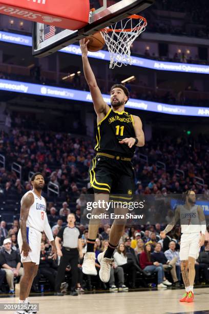 Klay Thompson of the Golden State Warriors goes up for a lay-up against the LA Clippers at Chase Center on February 14, 2024 in San Francisco,...