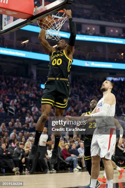 Jonathan Kuminga of the Golden State Warriors goes up for a dunk against the LA Clippers at Chase Center on February 14, 2024 in San Francisco,...