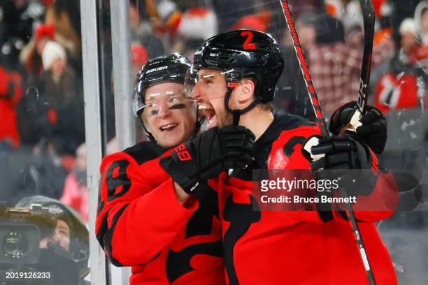 Brendan Smith of the New Jersey Devils is congratulated by Ondrej Palat after scoring a goal against the Philadelphia Flyers during the second period...