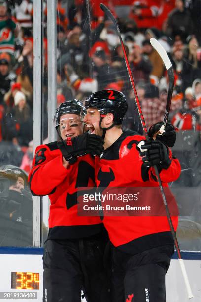 Brendan Smith of the New Jersey Devils is congratulated by Ondrej Palat after scoring a goal against the Philadelphia Flyers during the second period...