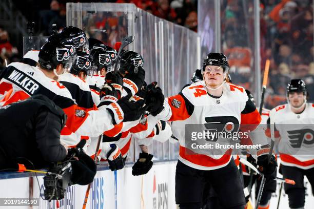 Owen Tippett of the Philadelphia Flyers is congratulated by his teammates after scoring a goal against the New Jersey Devils during the second period...