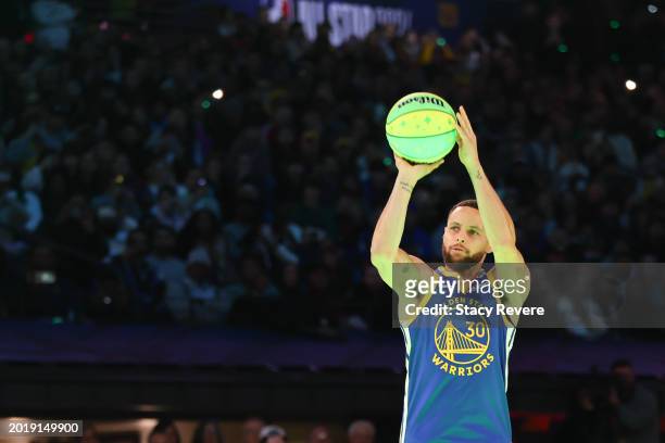 Stephen Curry of the Golden State Warriors participates in a 3-point challenge against Sabrina Ionescu of the New York Liberty during the State Farm...