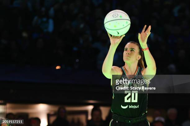 Sabrina Ionescu of the New York Liberty participates in a 3-point challenge against Stephen Curry of the Golden State Warriors during the State Farm...