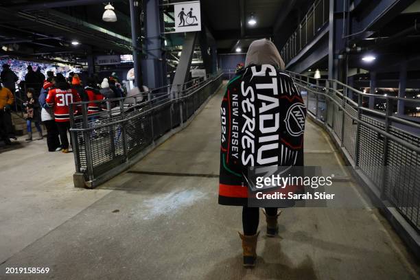 Fan walks the concourse with a blanket during the 2024 Navy Federal Credit Union Stadium Series between the New Jersey Devils and the Philadelphia...