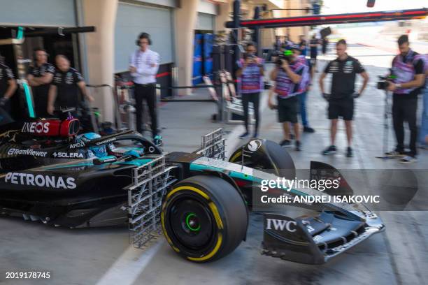 Mercedes' British driver George Russell leaves the garage during the first day of the Formula One pre-season testing at the Bahrain International...