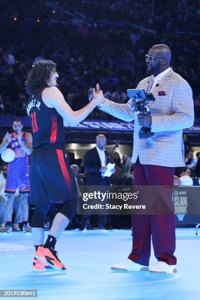 Jaime Jaquez Jr. #11 of the Miami Heat and Shaquille O'Neal shake hands on the court in the 2024 AT&T Slam Dunk contest during the State Farm...