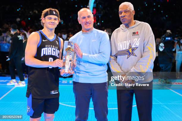 Mac McClung of the Osceola Magic poses for a photo with AT&T CEO John Stankey and Julius Erving after winning the 2024 AT&T Slam Dunk contest during...