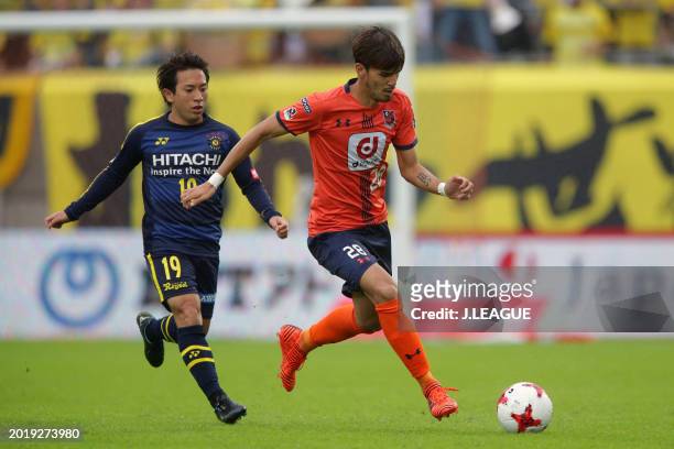 Aria Jasuru Hasegawa of Omiya Ardija controls the ball against Hiroto Nakagawa of Kashiwa Reysol during the J.League J1 match between Omiya Ardija...