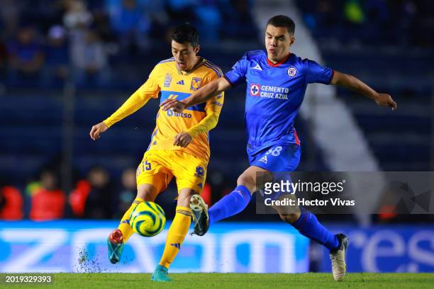 Eduardo Tercero of Tigres battles for possession with Mateo Levy of Cruz Azul during the 7th round match between Cruz Azul and Tigres UANL as part of...