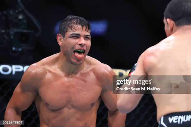 Paulo Costa of Brazil taunts Robert Whittaker of New Zealand in their middleweight fight during UFC 298 at Honda Center on February 17, 2024 in...