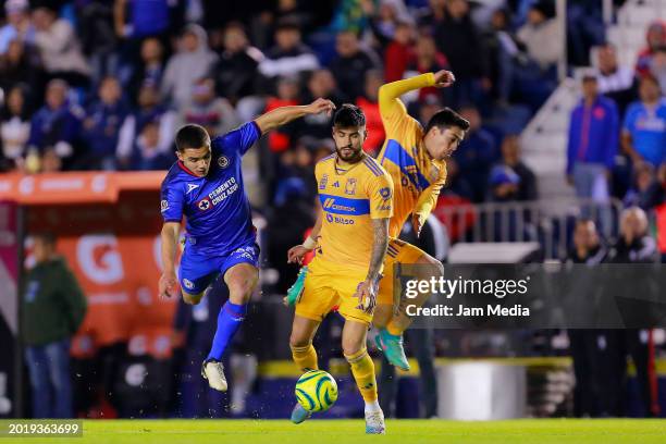 Mateo Levy of Cruz Azul fights for the ball with Juan Sanchez and Eduardo Tercero of Tigres during the 7th round match between Cruz Azul and Tigres...