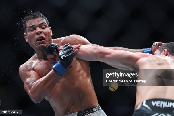 Robert Whittaker of New Zealand punches Paulo Costa of Brazil in their middleweight fight during UFC 298 at Honda Center on February 17, 2024 in...