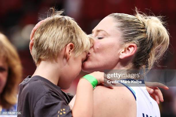 Lauren Jackson of the Flyers kisses her son Lennon as she speaks to family after the WNBL match between Sydney Flames and Southside Flyers at Qudos...
