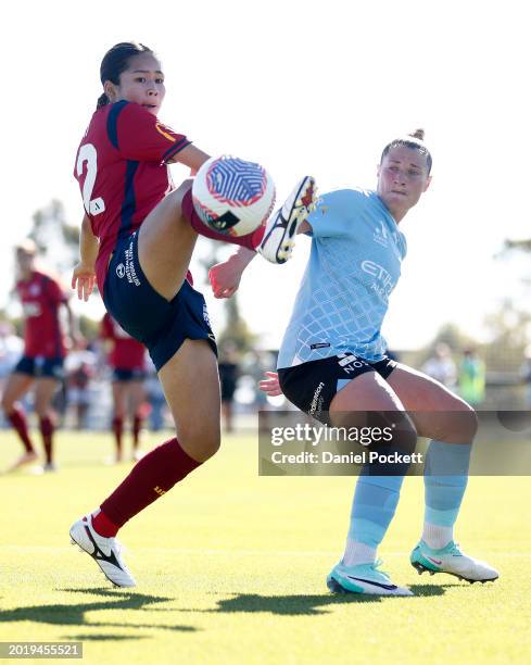 Nanako Sasaki of Adelaide United and Rhianna Pollicina of Melbourne City contest the ball during the A-League Women round 17 match between Melbourne...