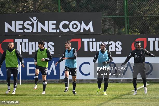 Cenk Tosun and Necip Uysal of Besiktas attend a training session at the BJK Nevzat Demir Facilities ahead of the football match between Istanbulspor...