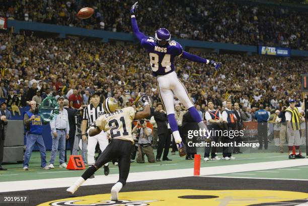 Wide receiver Randy Moss of the Minnesota Vikings just misses the football in the fourth quarter during the NFL game against the New Orleans Saints...