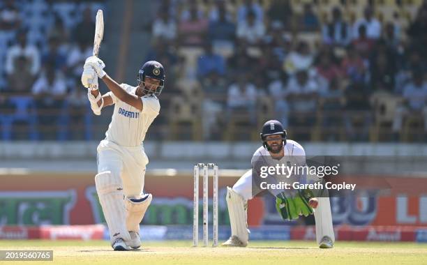 India batsman Yashasvi Jaiswal in batting action watched by Ben Foakes during day four of the 3rd Test Match between India and England at Saurashtra...