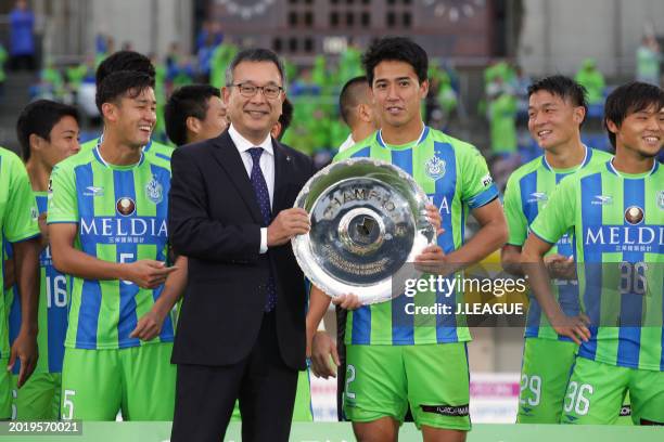 Captain Shunsuke Kikuchi of Shonan Bellmare is presented the J2 Champions plaque by J.League Chairman Mitsuru Murai at the award ceremony following...