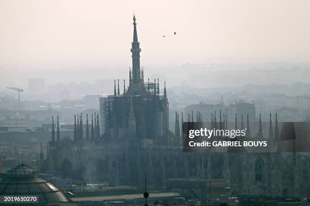 View of the Duomo Cathedral in Milan on February 21, 2024. Gas-guzzling cars were banned from roads Tuesday in Milan and eight other cities across...