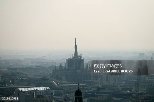 View of the Duomo Cathedral in Milan on February 21, 2024. Gas-guzzling cars were banned from roads Tuesday in Milan and eight other cities across...