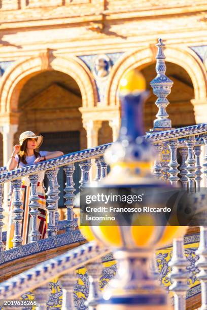 woman in plaza de espana, seville, andalusia, spain, europe - francesco riccardo iacomino spain stock pictures, royalty-free photos & images