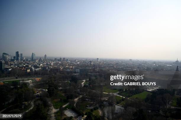 View of Milan's skyline with the Sempione park in the foreground on February 21, 2024. Gas-guzzling cars were banned from roads Tuesday in Milan and...