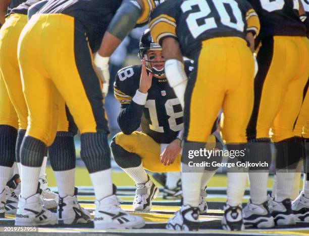 Quarterback Mike Tomczak of the Pittsburgh Steelers huddles with the offense during a game against the San Francisco 49ers at Three Rivers Stadium on...