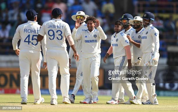 India bowler Kuldeep Yadav celebrates the wicket of Rehan Ahmed with team mates during day four of the 3rd Test Match between India and England at...