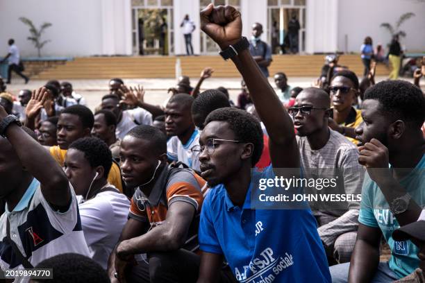 Student raises his fist at a sit-in outside the Cheikh Anta Diop University faculty of law to demand the reopening of the university and denouncing...