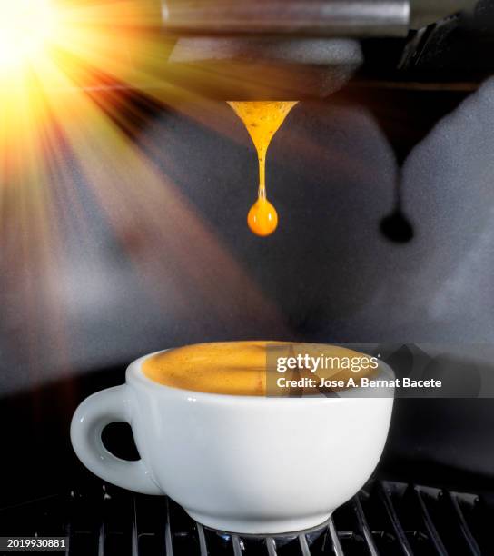 machine of coffee of capsules with a cup of warm and creamy coffee. - single serve coffee maker stock pictures, royalty-free photos & images