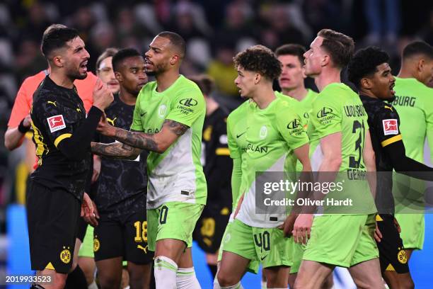 Emre Can of Borussia Dortmund discuss with Yannick Gerhardt of VfL Wolfsburg during the Bundesliga match between VfL Wolfsburg and Borussia Dortmund...