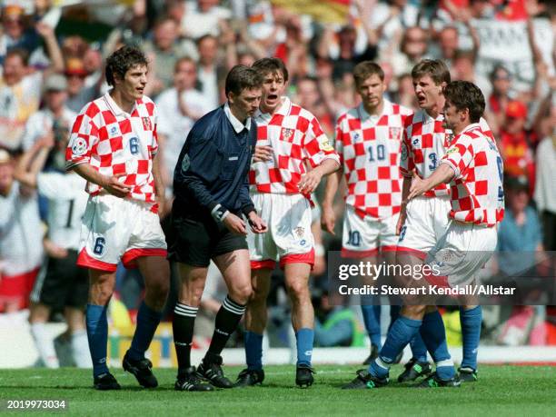 June 23: Slaven Bilic, Davor Suker and Robert Jarni of Croatia appeal to Referee Leif Sundell during the UEFA Euro 1996 Quarter Final match between...