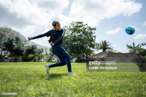 woman soccer player kicking ball during training session - south africa training session stock pictures, royalty-free photos & images