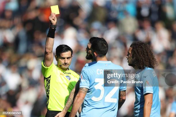 Referee Fabio Maresca shows a yellow card to Danilo Cataldi of SS Lazio during the Serie A TIM match between SS Lazio and Bologna FC at Stadio...