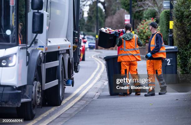 Council refuse collection employees load rubbish in to a collection lorry in the Sutton Coldfield area of Birmingham, UK, on Tuesday, Feb. 20, 2024....